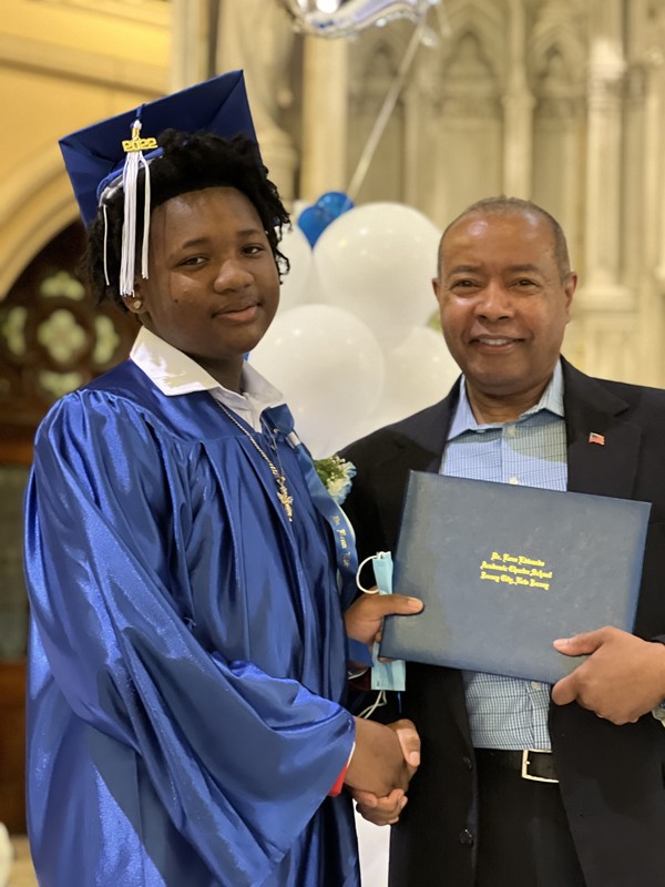 Principal Brewer gives graduates diplomas